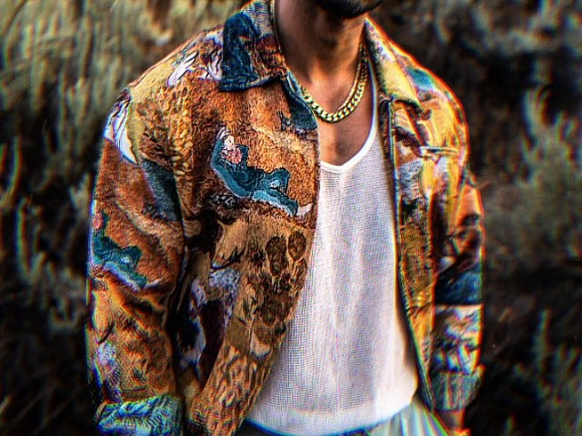 Man wearing the Van Gogh Denim Structured Jacket over a white tank, outdoors at golden hour